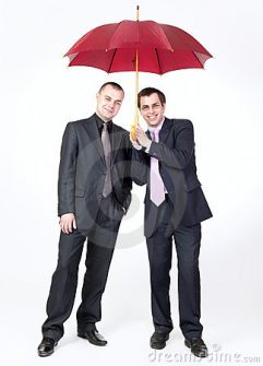 two-businessmen-standing-under-umbrella-19914129